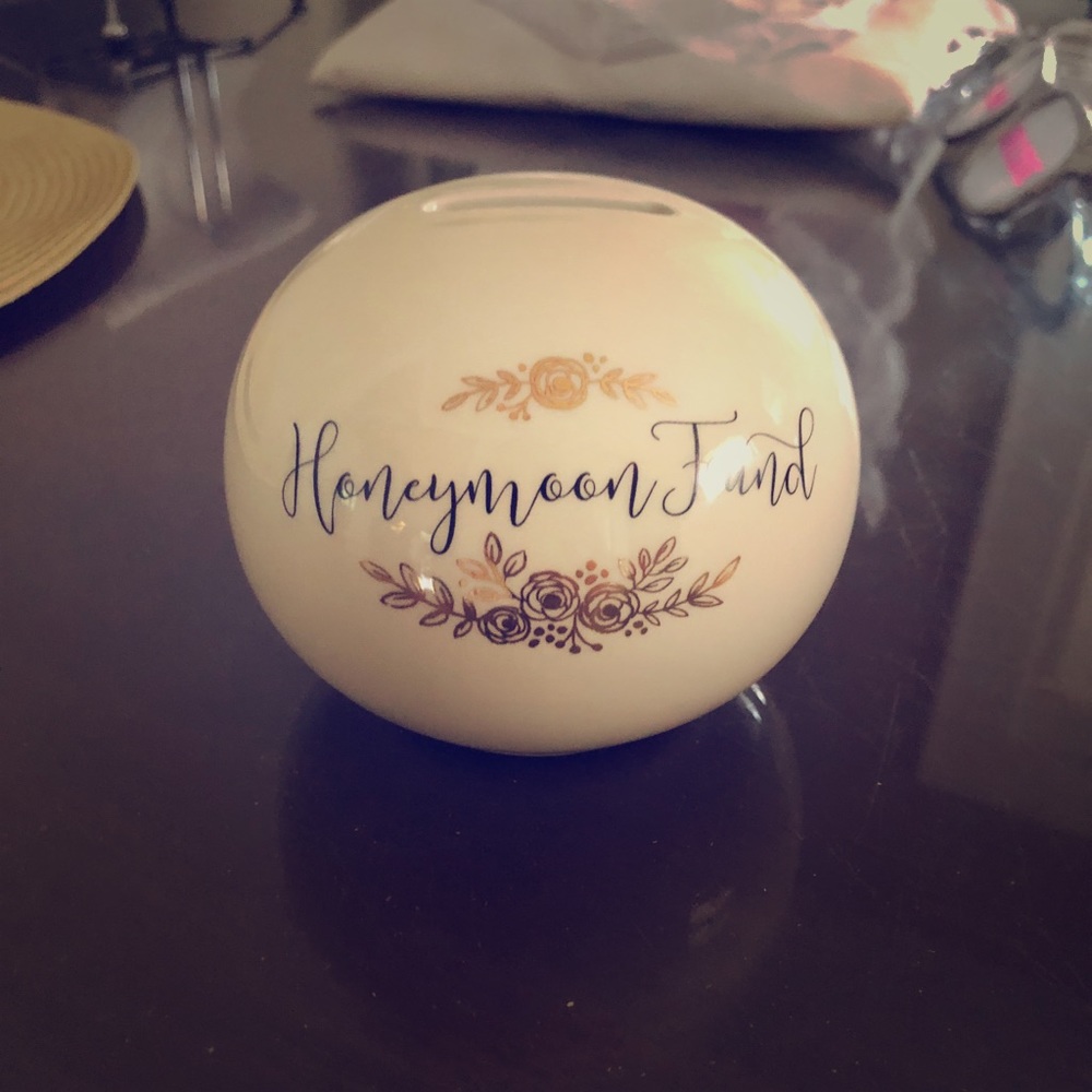 “Honeymoon fund” coin jar.